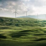 Energy Efficient - wind turbine surrounded by grass