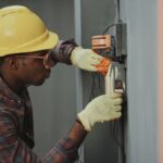 Maintenance - man in brown hat holding black and gray power tool