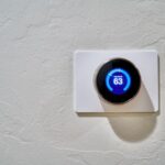 Smart Thermostats - white thermostat at 62