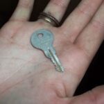 Key Features - gray key in person's palm